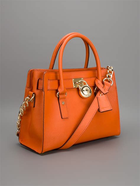 michael kors orange bag spikes|Michael Kors orange totes.